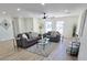 Open living room with a neutral color scheme and bright natural light from several windows at 6607 S Mitchell Dr, Tempe, AZ 85283