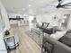 Spacious living room with hardwood floors, ceiling fan, and comfortable seating area at 6607 S Mitchell Dr, Tempe, AZ 85283