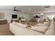 Bright living room with modern furnishings open to a spacious kitchen and dining area at 6607 S Mitchell Dr, Tempe, AZ 85283