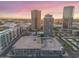 Stunning aerial view of the city skyline with modern buildings and ample parking at sunset at 1 E Lexington Ave # 1302, Phoenix, AZ 85012