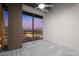 Bedroom with neutral paint, ceiling fan and access to additional rooms at 1 E Lexington Ave # 1302, Phoenix, AZ 85012