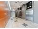 Hallway leading to modern elevators, featuring stylish lighting and contemporary design at 1 E Lexington Ave # 1302, Phoenix, AZ 85012