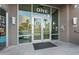 Contemporary building entrance with glass doors, stylish lighting and views of building across street at 1 E Lexington Ave # 1302, Phoenix, AZ 85012