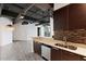 Well-equipped kitchen showcasing sleek countertops, stainless steel dishwasher, and a view of the living area at 1 E Lexington Ave # 1302, Phoenix, AZ 85012