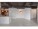 Open-concept living space highlighting a kitchen island, chandelier lighting, and modern design elements at 1 E Lexington Ave # 1302, Phoenix, AZ 85012