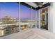 Modern living room with floor to ceiling windows and city views at 1 E Lexington Ave # 1302, Phoenix, AZ 85012