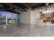 Inviting living space leading to a modern kitchen with a breakfast bar and expansive windows at 1 E Lexington Ave # 1302, Phoenix, AZ 85012