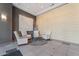 Comfortable waiting area in lobby with four chairs, a round table and attractive wall design at 1 E Lexington Ave # 1302, Phoenix, AZ 85012