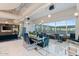 Stylish lounge and dining area featuring modern furnishings and floor-to-ceiling windows with city views at 1 E Lexington Ave # 1302, Phoenix, AZ 85012
