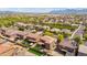 Scenic aerial perspective showcasing an organized neighborhood with landscaped yards and picturesque mountain views at 12172 W Davis Ln, Avondale, AZ 85323