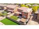 Overhead view of an enclosed yard with green lawn, patio space, and perimeter fence for privacy and recreation at 12172 W Davis Ln, Avondale, AZ 85323