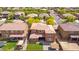 Aerial view of a backyard featuring a well-kept lawn, patio area, and mature trees for a private outdoor retreat at 12172 W Davis Ln, Avondale, AZ 85323