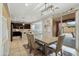 Bright dining room features a stylish light fixture and sliding glass doors to the outdoor area at 12172 W Davis Ln, Avondale, AZ 85323