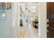Spacious foyer featuring high ceilings, a staircase, tile flooring, and neutral wall paint throughout at 12172 W Davis Ln, Avondale, AZ 85323