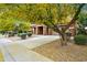 Beautiful home exterior with a well-maintained lawn and mature trees providing ample shade and curb appeal at 12172 W Davis Ln, Avondale, AZ 85323
