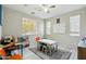 Multipurpose room with flexible furniture, large window for natural light, and ceiling fan at 12172 W Davis Ln, Avondale, AZ 85323
