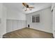 Bedroom with natural light and wood paneling at 12469 W Hearn Rd, El Mirage, AZ 85335