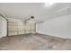 Spacious garage with automatic door, offering ample room for parking and storage solutions at 12469 W Hearn Rd, El Mirage, AZ 85335