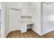 Charming home office with built-in desk, stylish cabinets, and gleaming white trim details at 12469 W Hearn Rd, El Mirage, AZ 85335