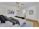 Comfortable main bedroom with ceiling fan and en suite bathroom at 12469 W Hearn Rd, El Mirage, AZ 85335
