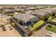 Aerial view of the property featuring a well-maintained backyard, covered patio, and inviting outdoor space at 13806 W Remuda Dr, Peoria, AZ 85383