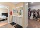 Bathroom with a double vanity, open access to the bedroom and a walk-in closet at 13806 W Remuda Dr, Peoria, AZ 85383