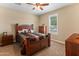 Cozy bedroom featuring a wooden bed frame with matching furniture, plush carpeting, and natural light at 13806 W Remuda Dr, Peoria, AZ 85383