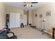 Bedroom with carpet floors, neutral walls, exercise bench and punching bag at 13806 W Remuda Dr, Peoria, AZ 85383