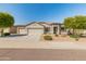 Lovely single-story home boasting a manicured front yard adorned with desert landscaping and convenient three-car garage at 13806 W Remuda Dr, Peoria, AZ 85383
