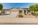 Well maintained single-story home featuring a three car garage and drought tolerant landscaping at 13806 W Remuda Dr, Peoria, AZ 85383