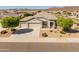 Beautiful single-story home featuring a well manicured xeriscaped front yard and a spacious three car garage at 13806 W Remuda Dr, Peoria, AZ 85383