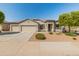 Charming single-story home with xeriscaping, mature trees, and a three car garage at 13806 W Remuda Dr, Peoria, AZ 85383