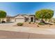 Well kept single-story home with a three car garage, mature shade trees, and xeriscaping at 13806 W Remuda Dr, Peoria, AZ 85383