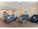 Inviting living room with tile flooring, comfortable sofas, and natural light at 13806 W Remuda Dr, Peoria, AZ 85383