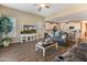 Open concept living room with tile flooring, neutral paint and view to the kitchen at 13806 W Remuda Dr, Peoria, AZ 85383