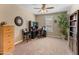 Comfortable office with a desk, carpeted floors, and a plant for a calm workspace at 13806 W Remuda Dr, Peoria, AZ 85383