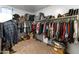 Spacious walk-in closet with built-in shelving and ample storage space for clothes and accessories at 13806 W Remuda Dr, Peoria, AZ 85383