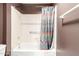 Bathroom featuring a shower and tub combination and colorful shower curtain at 14154 W Yosemite Dr, Sun City West, AZ 85375