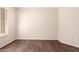 Bedroom featuring hardwood floors and shuttered windows allowing natural light at 14154 W Yosemite Dr, Sun City West, AZ 85375