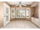 Bright breakfast nook, including fan, white shutters, tiled floor and lots of natural light at 14154 W Yosemite Dr, Sun City West, AZ 85375