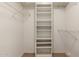 Walk-in closet featuring built-in shelving and ample storage space at 14154 W Yosemite Dr, Sun City West, AZ 85375