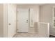 Bright entryway with tile flooring, white walls and storage at 14154 W Yosemite Dr, Sun City West, AZ 85375