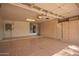 Spacious garage featuring ample storage cabinets and durable patterned concrete flooring at 14154 W Yosemite Dr, Sun City West, AZ 85375