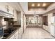 Eat-in kitchen with modern appliances, granite countertops, and a large window area with natural light at 14154 W Yosemite Dr, Sun City West, AZ 85375