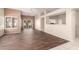 Spacious living room features wood floors, neutral paint, and plentiful natural light at 14154 W Yosemite Dr, Sun City West, AZ 85375