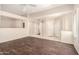 Open-concept living space with hardwood floors, lots of natural light, and neutral walls at 14154 W Yosemite Dr, Sun City West, AZ 85375