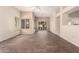 Spacious living area with light hardwood floors, plantation shutters, and bright, neutral walls at 14154 W Yosemite Dr, Sun City West, AZ 85375