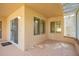 Cozy outdoor patio with decorative flooring, sliding glass doors, and ample natural light at 14154 W Yosemite Dr, Sun City West, AZ 85375