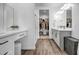 Spacious bathroom featuring double vanity, wood-look tile floors, a walk-in shower, and a walk-in closet at 1482 W Gloucester W Rd, San Tan Valley, AZ 85143