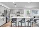 Modern kitchen with a large island, stainless steel appliances, and seating at 1482 W Gloucester W Rd, San Tan Valley, AZ 85143